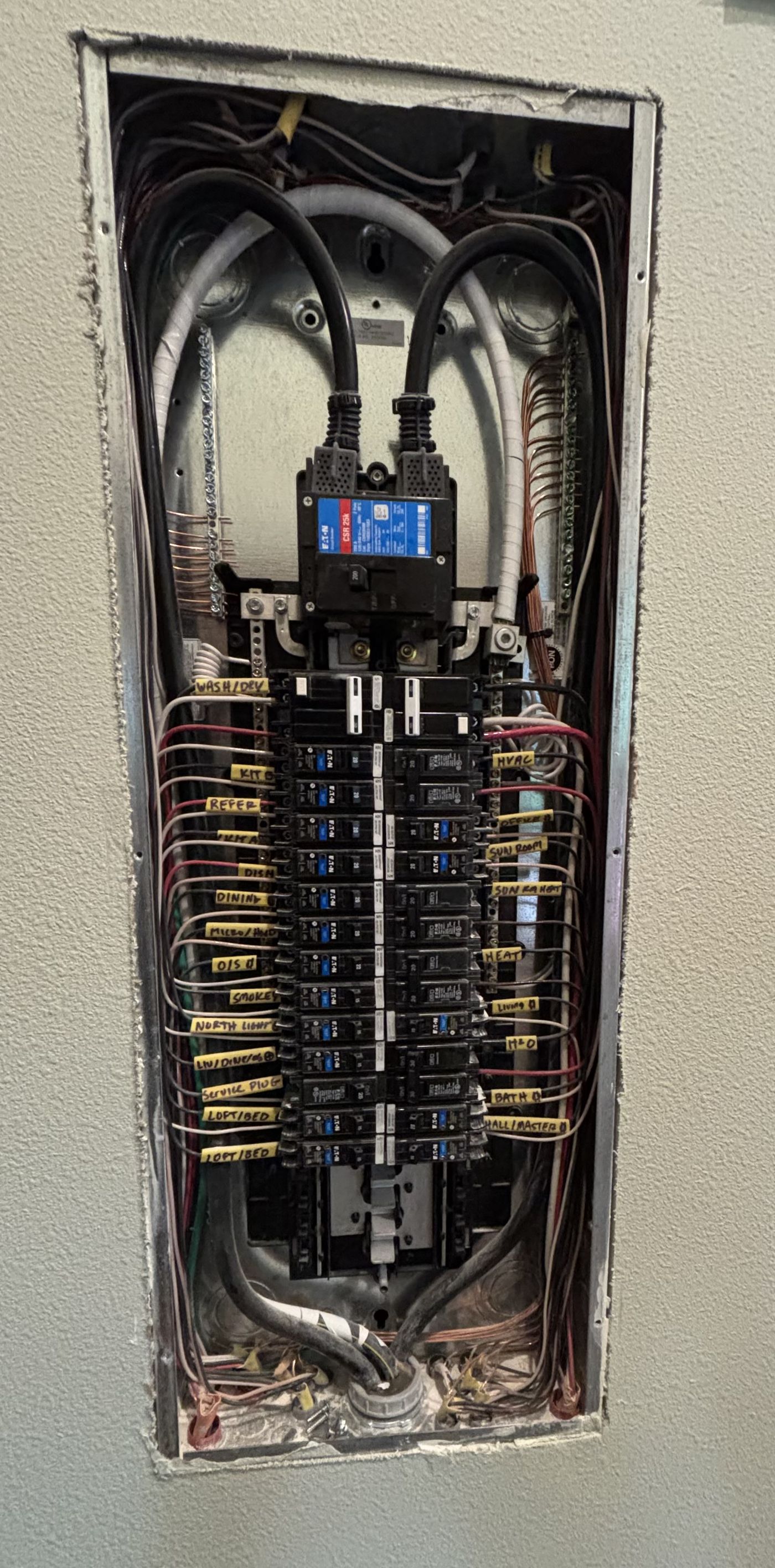Residential electrical panel in Gig Harbor with the cover removed, circuits dressed and labelled
