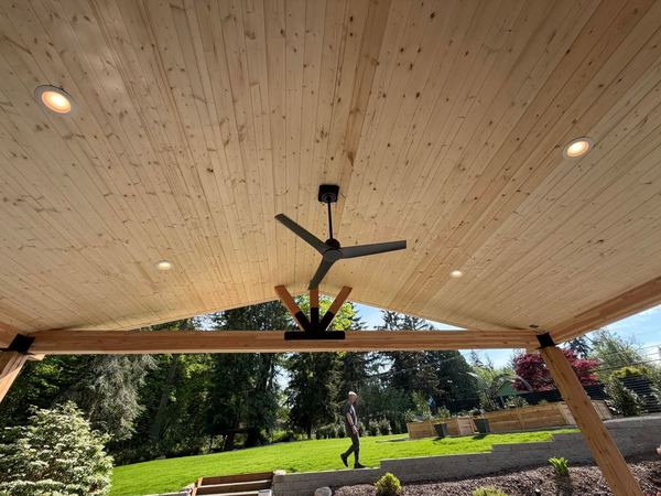 Cedar-lined covered patio ceiling in Kingston with recessed lighting and a large ceiling fan