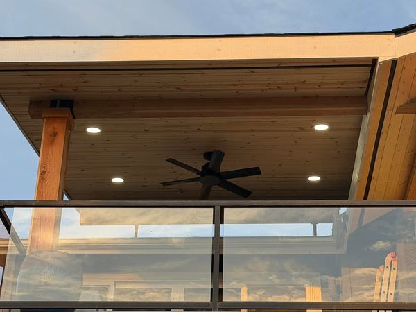 Covered patio in University Place with recessed ceiling lighting, a fan and a glass rail